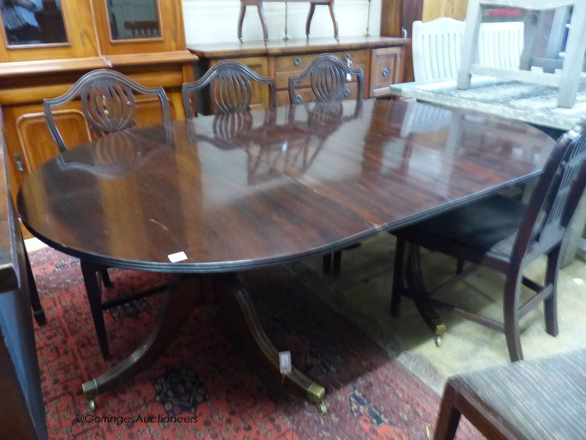 A mahogany two-pedestal dining table (one additional leaf) 186cm extended, width 114cm, height 71cm